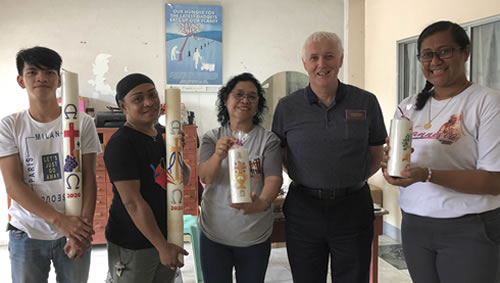 Fr. Timothy Mulrow and Haiti (right) with the candle making team