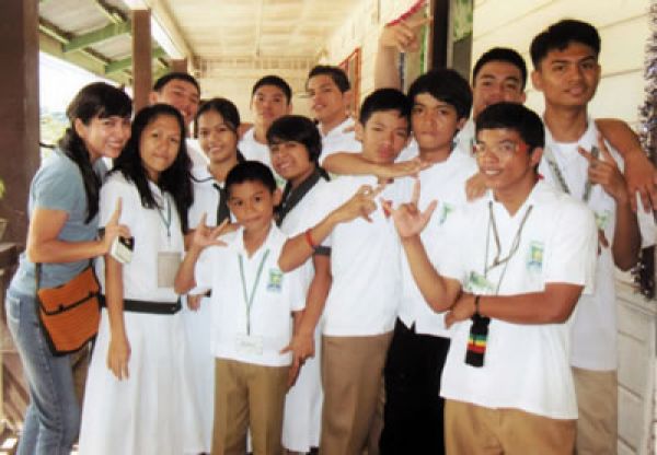 Marisol (left) with deaf students in the Philippines