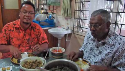 Fr. Kurt eating lunch with Uncle Bale