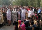 Patients wait for the clinic to open.